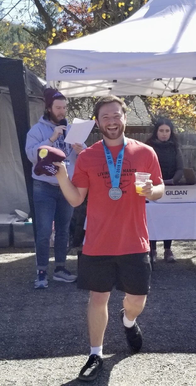 Jonathan accepting 1st place in age group at Catskill Brewery 5k